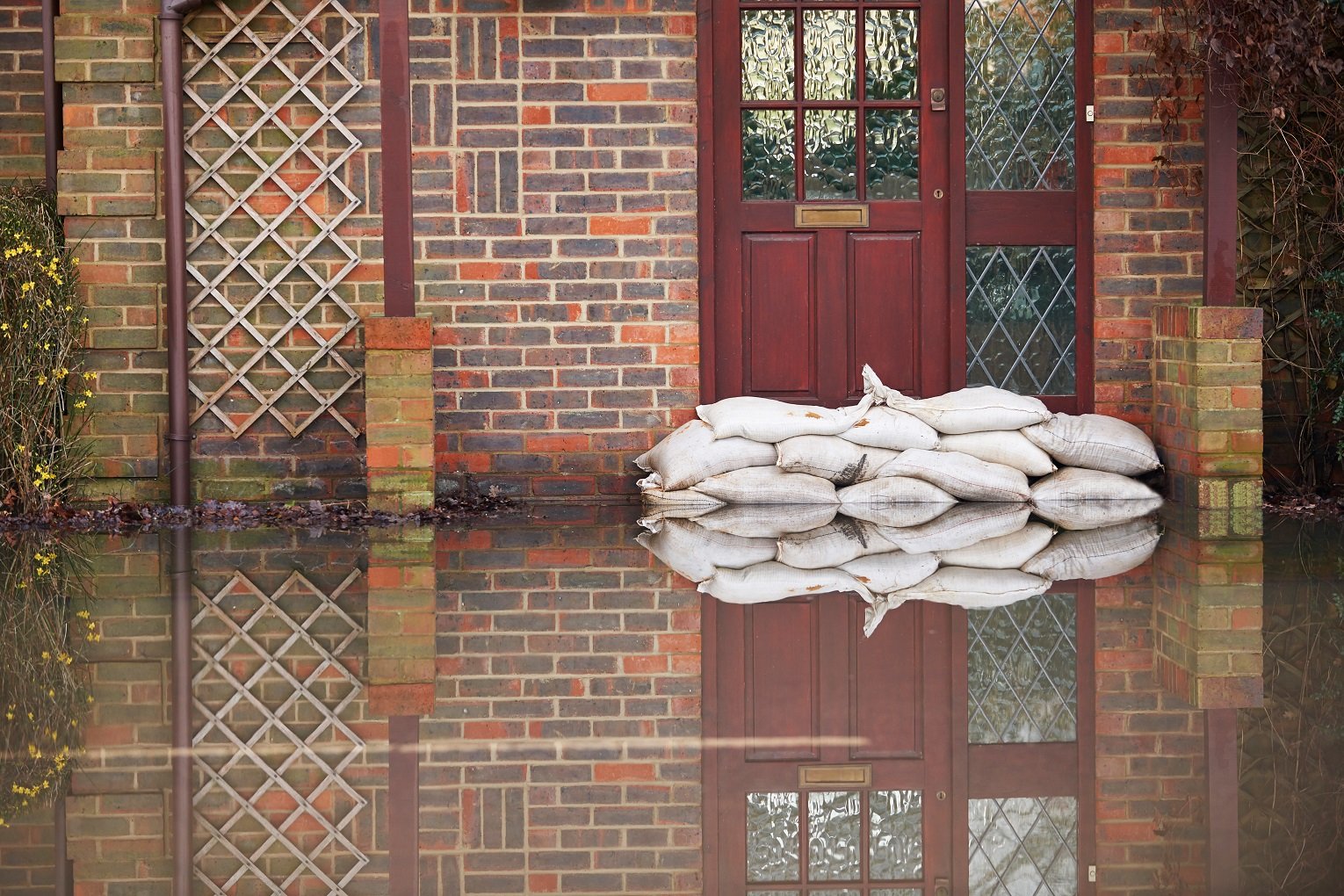 how much renters insurance Naborly Sandbags Outside Front Door Of Flooded House